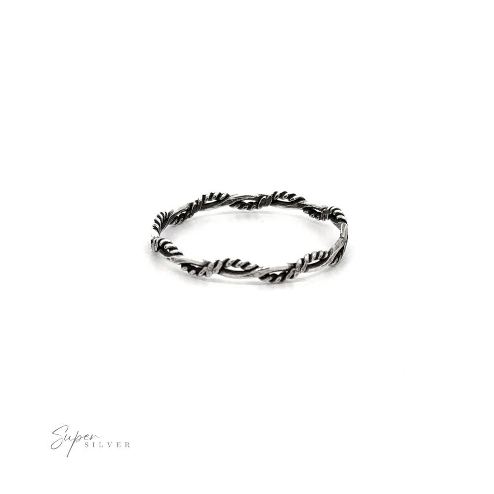 A delicate Tiny Twisted Rope Band Ring adorned with leaves, offering a minimal and nature-inspired design.
