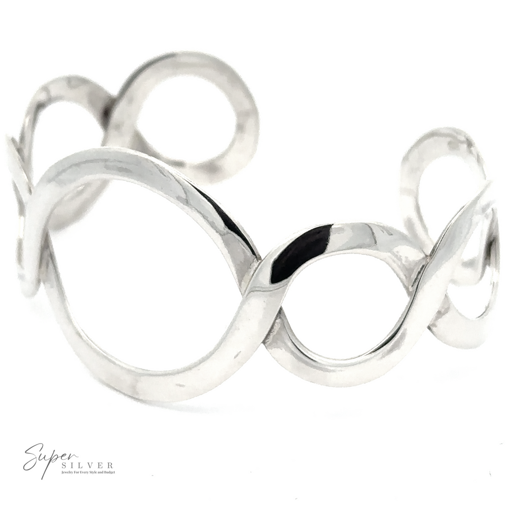 A Twisted Graduated Circle Cuff featuring an intertwined loop design with a unique graduated circle pattern and the logo "Super Silver" in the bottom left corner.