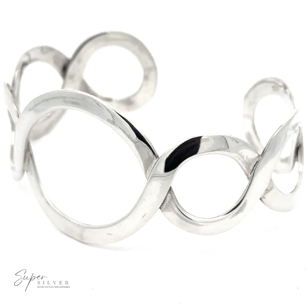 A Twisted Graduated Circle Cuff featuring an intertwined loop design with a unique graduated circle pattern and the logo 