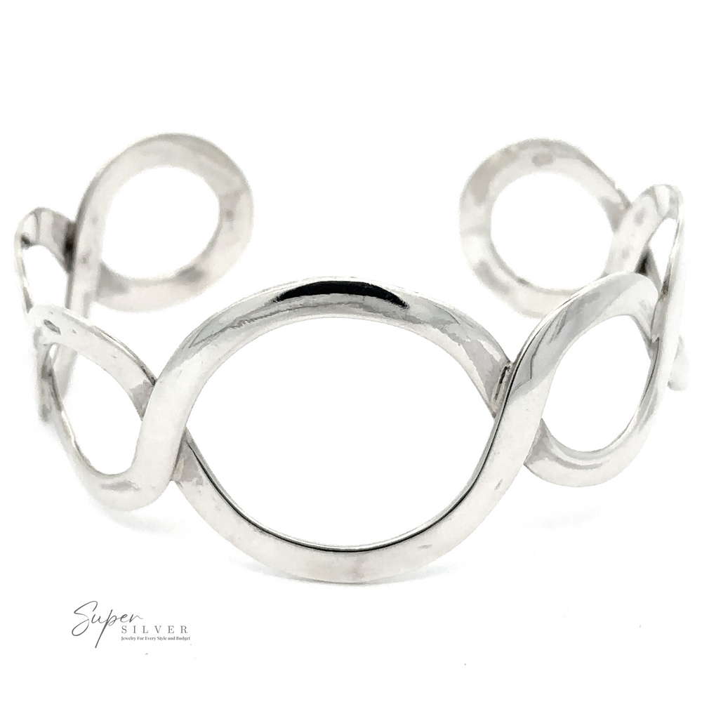 
                  
                    A minimalist silver cuff bracelet with an open oval and twisted wire design. The unique graduated circle pattern adds a touch of elegance. Text on the bracelet reads "Twisted Graduated Circle Cuff," making it a standout piece of sterling silver jewelry.
                  
                