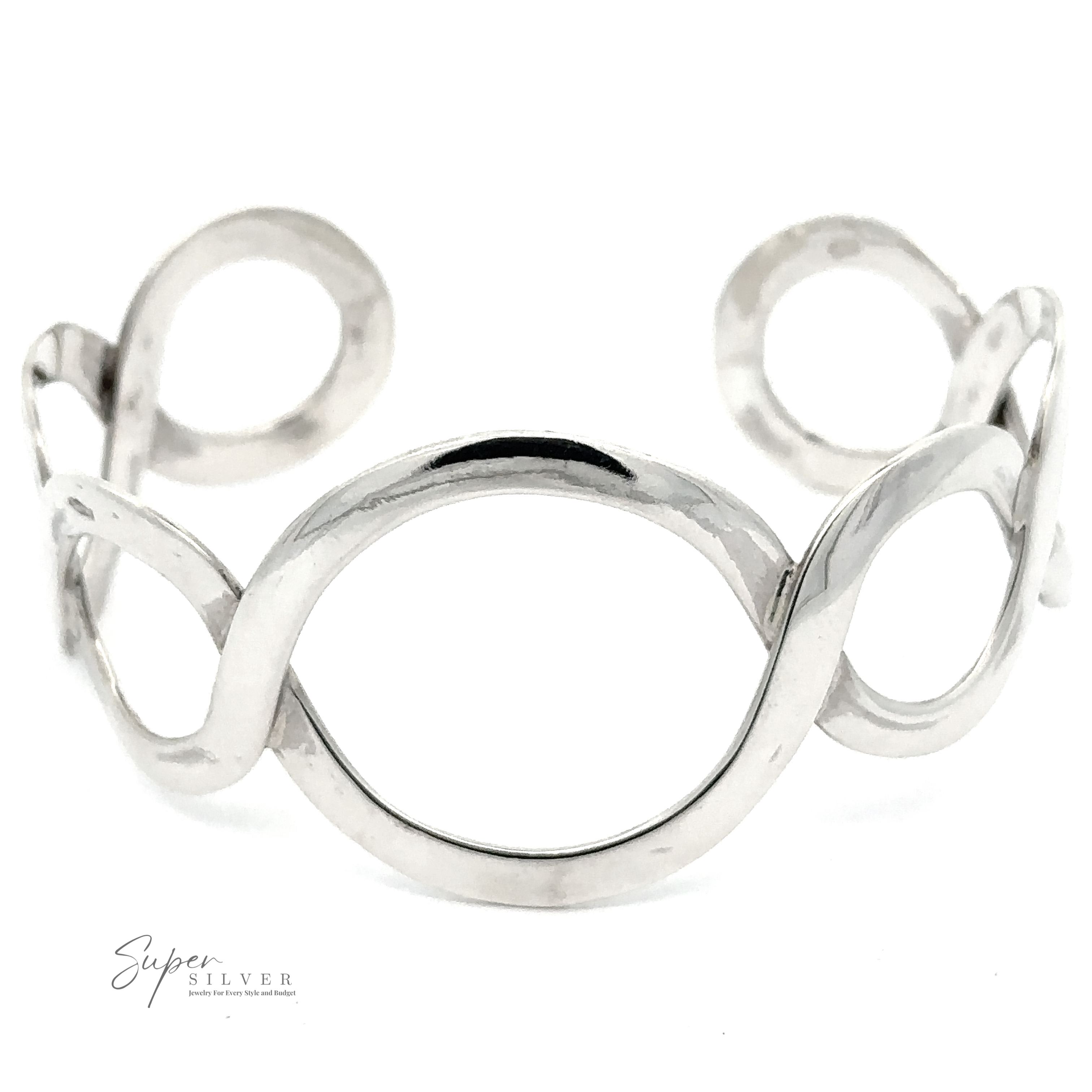 A minimalist silver cuff bracelet with an open oval and twisted wire design. The unique graduated circle pattern adds a touch of elegance. Text on the bracelet reads "Twisted Graduated Circle Cuff," making it a standout piece of sterling silver jewelry.