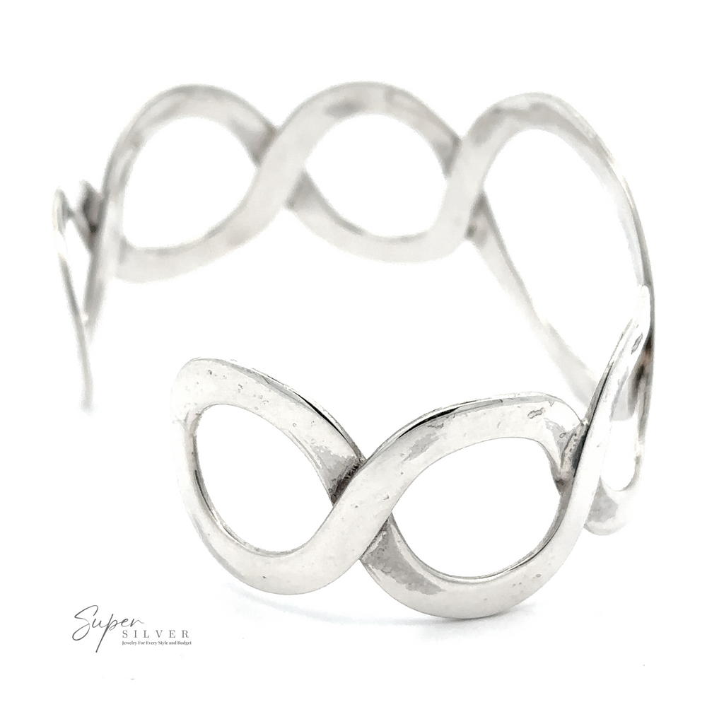 
                  
                    A sterling silver cuff bracelet with an infinity design, featuring curves forming interlocking loops. This chic accessory is labeled "Twisted Graduated Circle Cuff.
                  
                