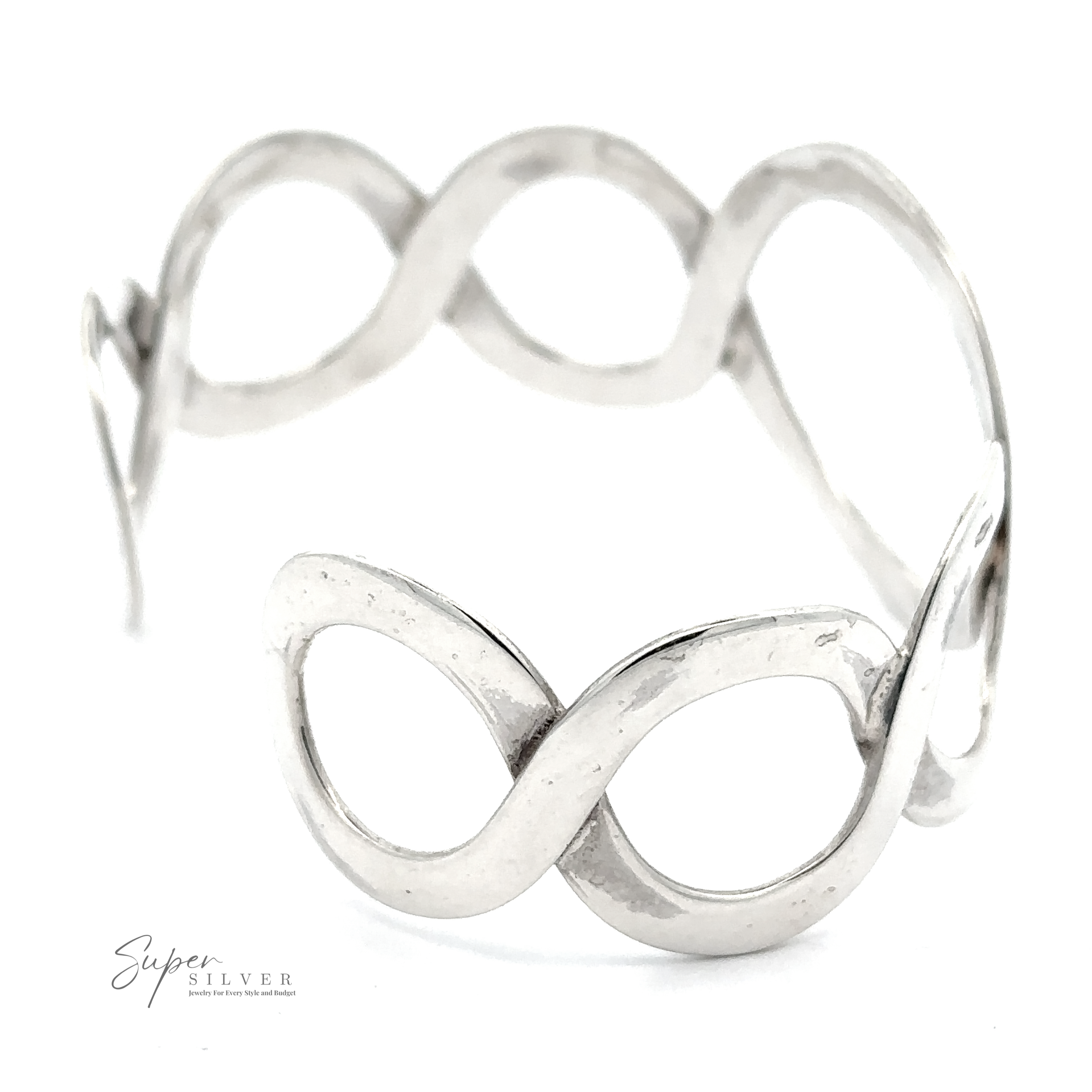 A sterling silver cuff bracelet with an infinity design, featuring curves forming interlocking loops. This chic accessory is labeled "Twisted Graduated Circle Cuff.