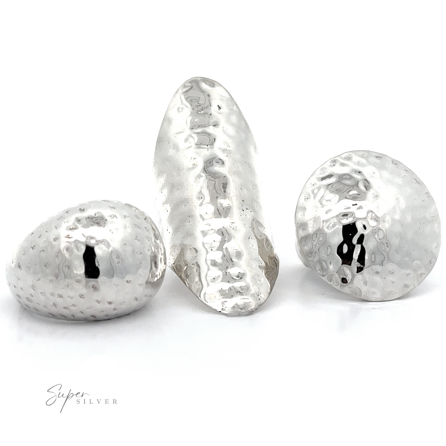 
                  
                    Three Statement Hammered Rings with silver hammered balls on a white background, exuding boldness.
                  
                