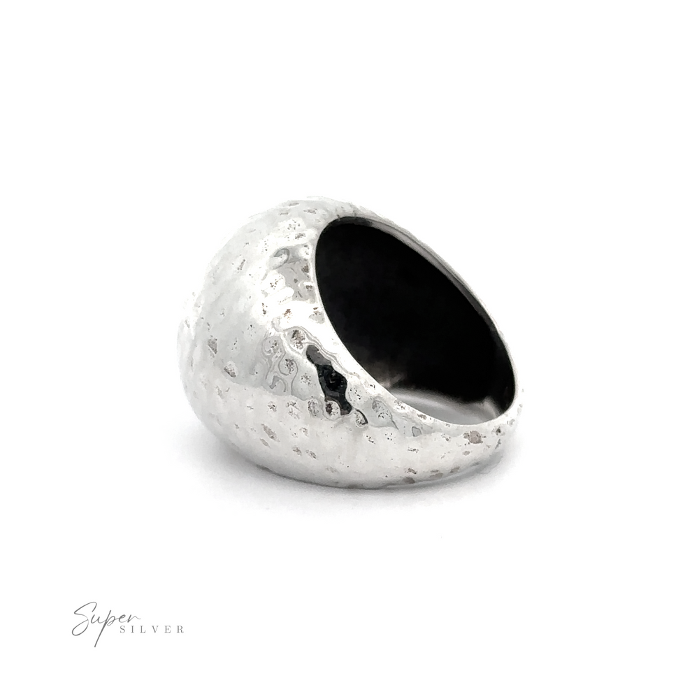 
                  
                    A shimmering silver ring from the Statement Hammered Rings collection, showcased on a pristine white background.
                  
                