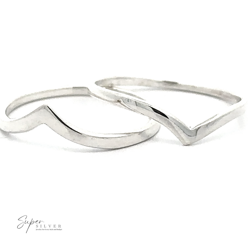 Two minimalist .925 Sterling Silver rings, one showcasing a wavy design and the other a Delicate Silver Chevron Ring, positioned side by side on a white background. The text 