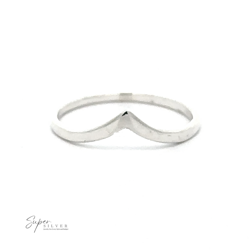 A simple, thin silver ring with a subtle V-shaped design in the center, embodying modern minimalism. Made from .925 Sterling Silver, it features the Delicate Silver Chevron Ring logo in the bottom left corner.
