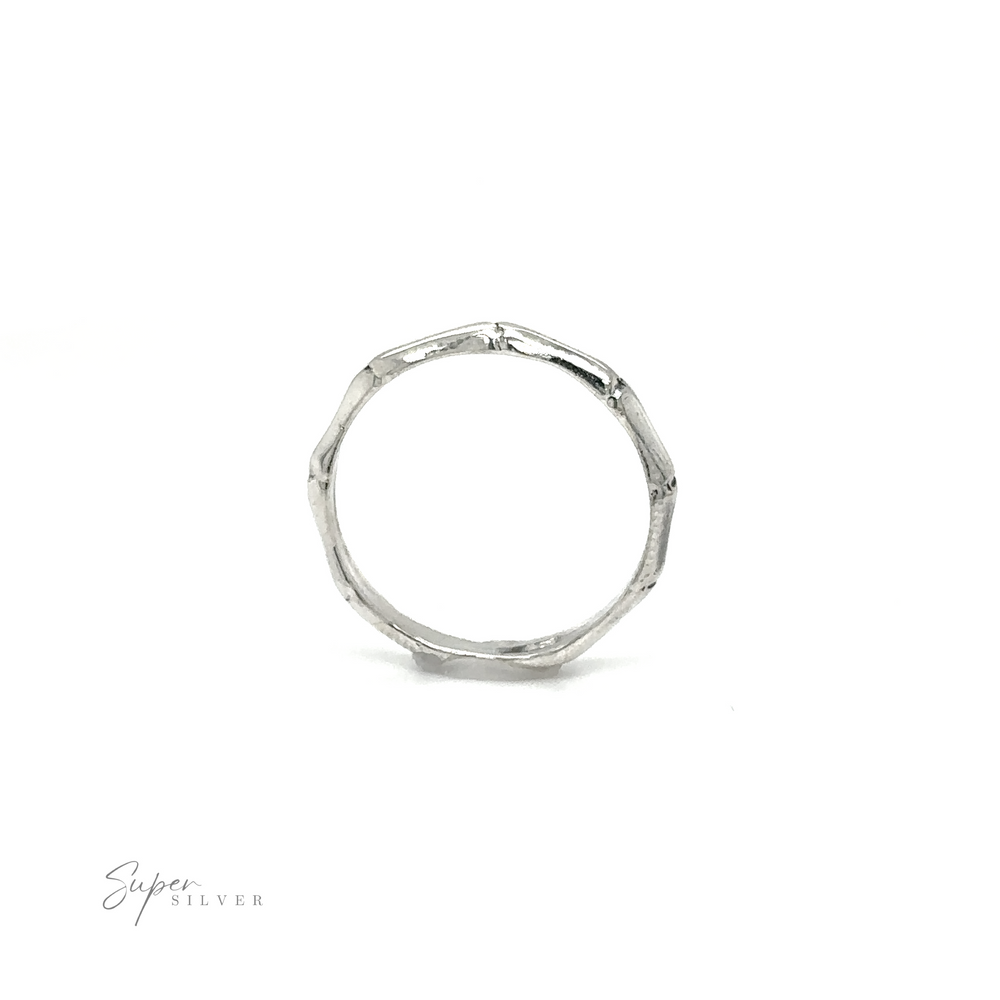 
                  
                    A Bamboo Band Silver Ring by Super Silver with a simple design.
                  
                