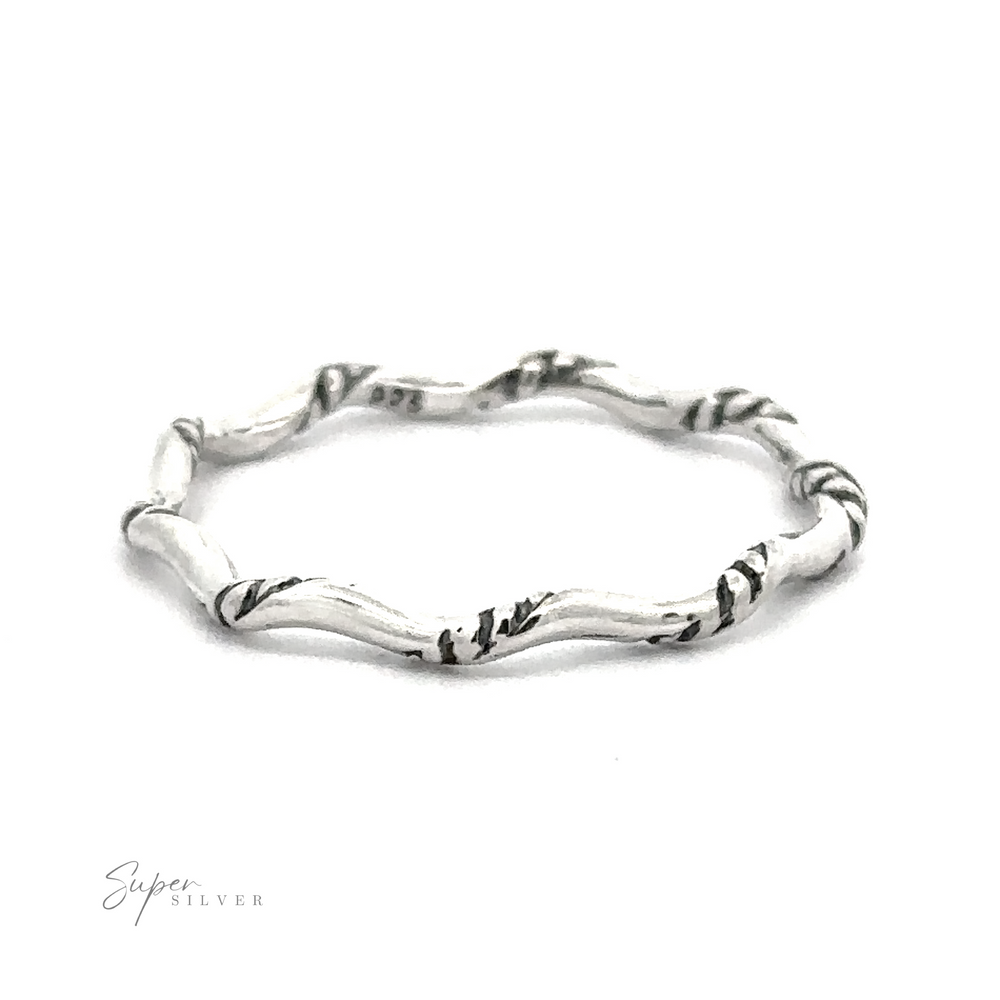 A Sterling Silver Wavy Rope Band with a twisted design.