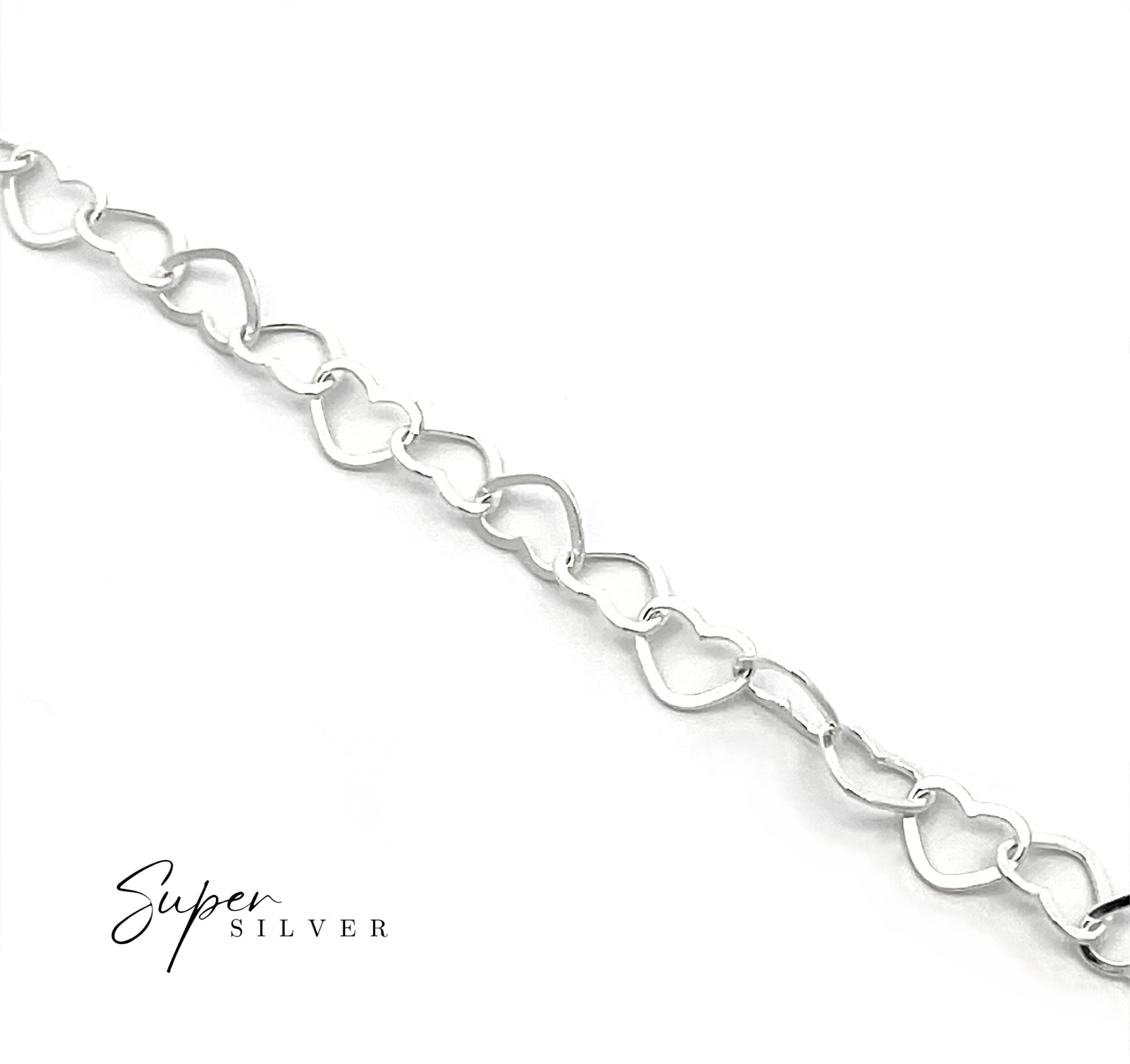 The Italian Heart Link Chain, a sterling silver bracelet with interconnected heart-shaped links, is displayed diagonally on a white background with "Super Silver" in the bottom left corner.