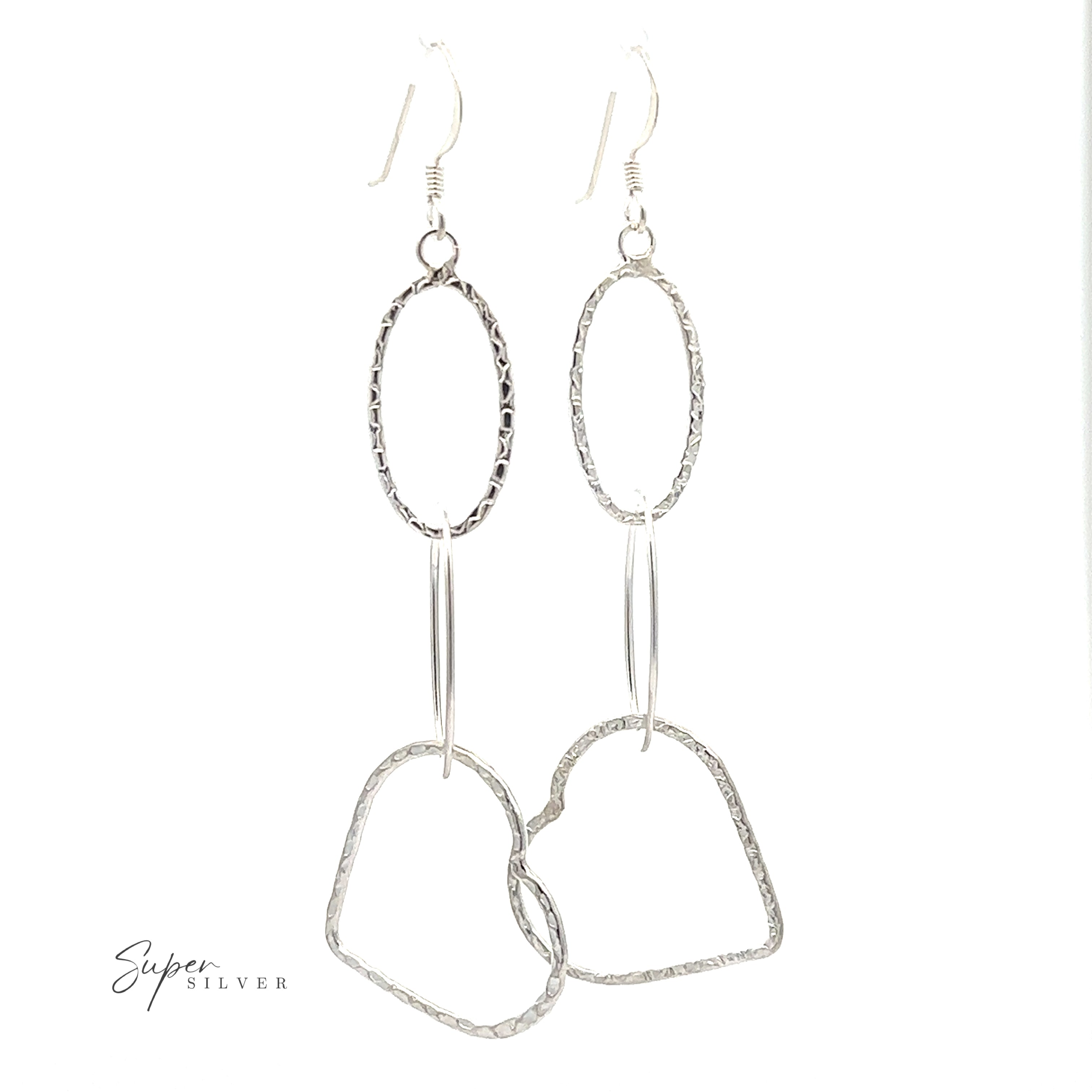 A pair of Hammered Three Tiered Heart Dangle Earrings.