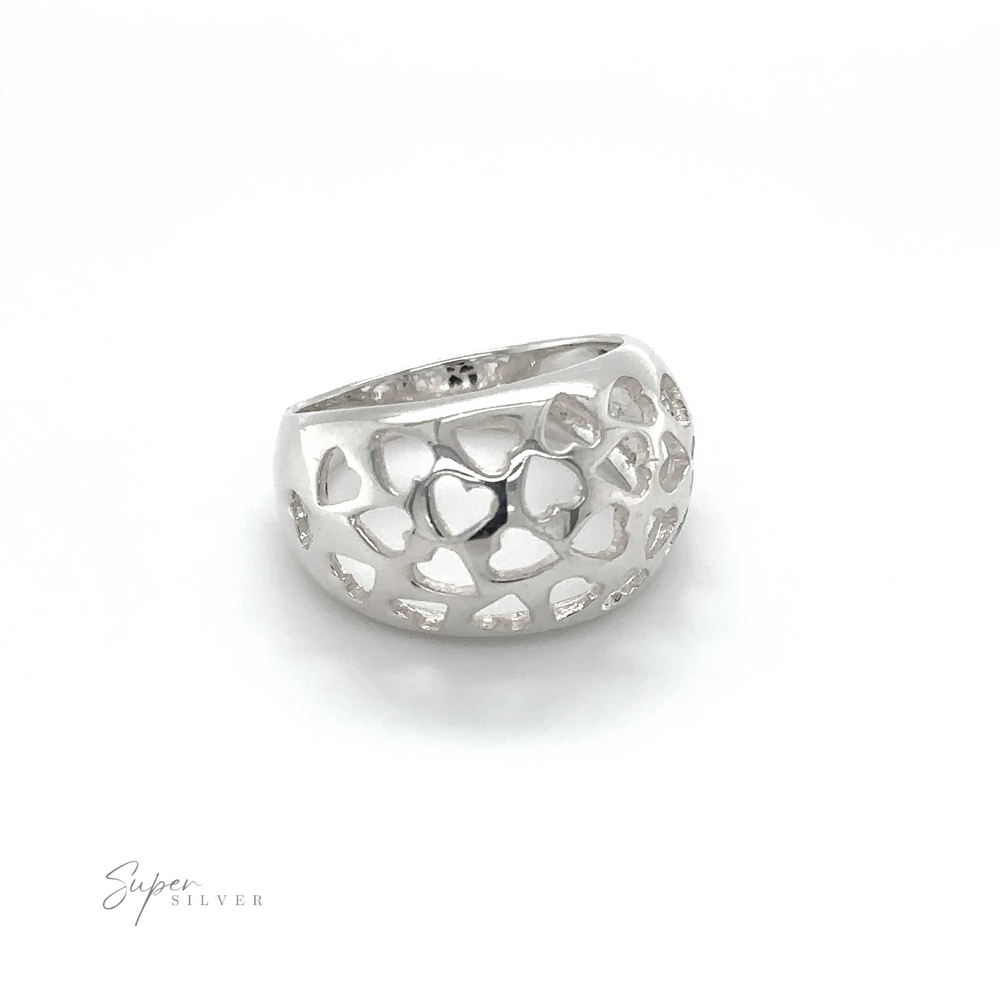 A minimalist Domed Ring Cut-Out Hearts made of sterling silver with a heart-shaped design.