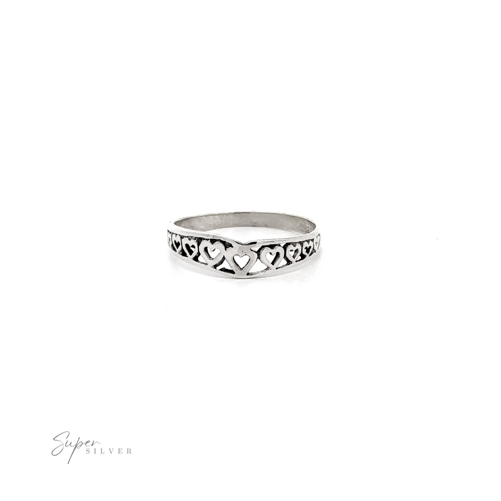 Chevron Shaped Ring Lined with Hearts with a "super silver" signature below.