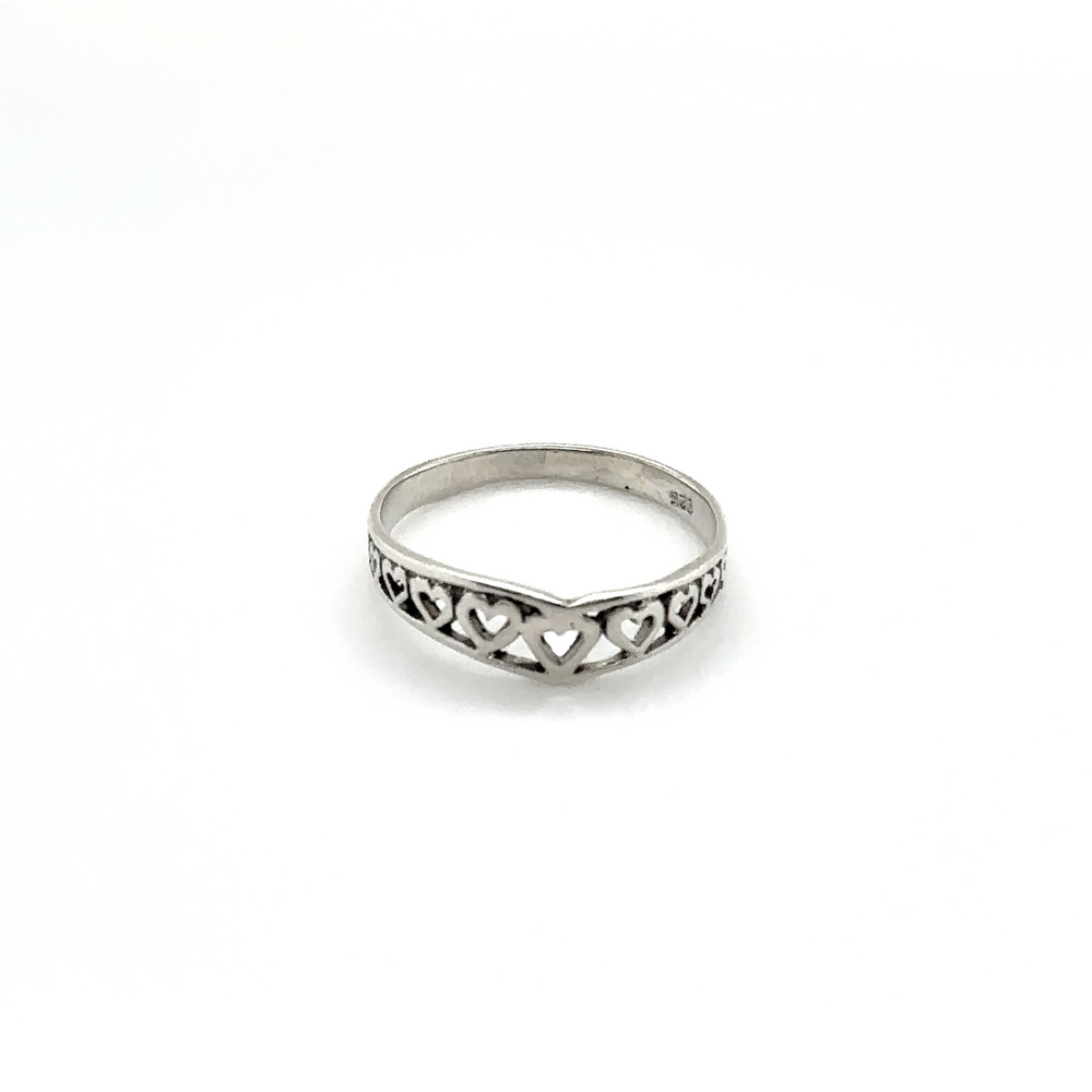 
                  
                    A minimalist Chevron Shaped Ring Lined with Hearts with an intricate heart design.
                  
                