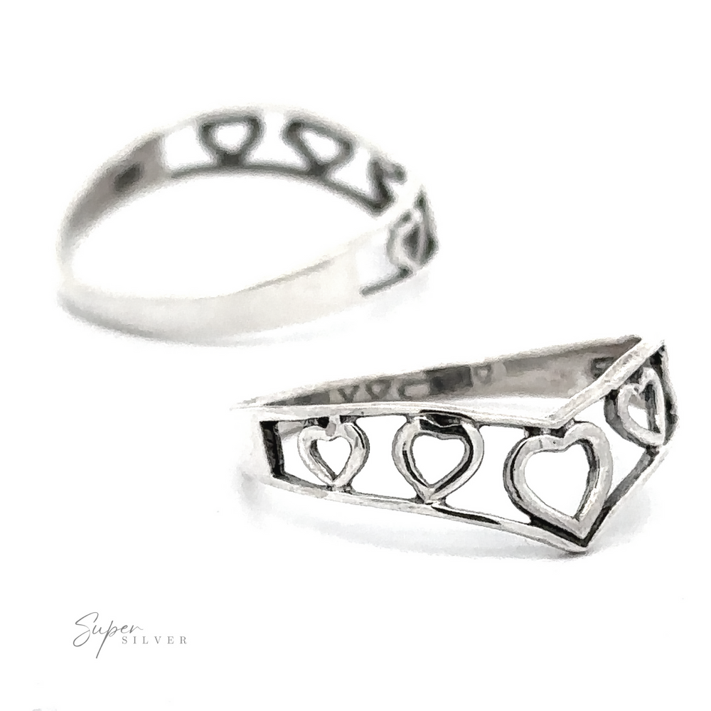 Chevron Shaped Open Heart Band featuring a row of heart cut-outs, displayed against a white background with a blurred 