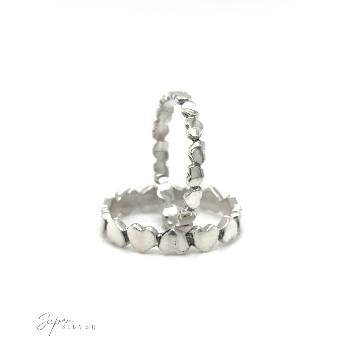 
                  
                    A pair of Hearts Band With Alternating Pattern stacking rings on a white background.
                  
                