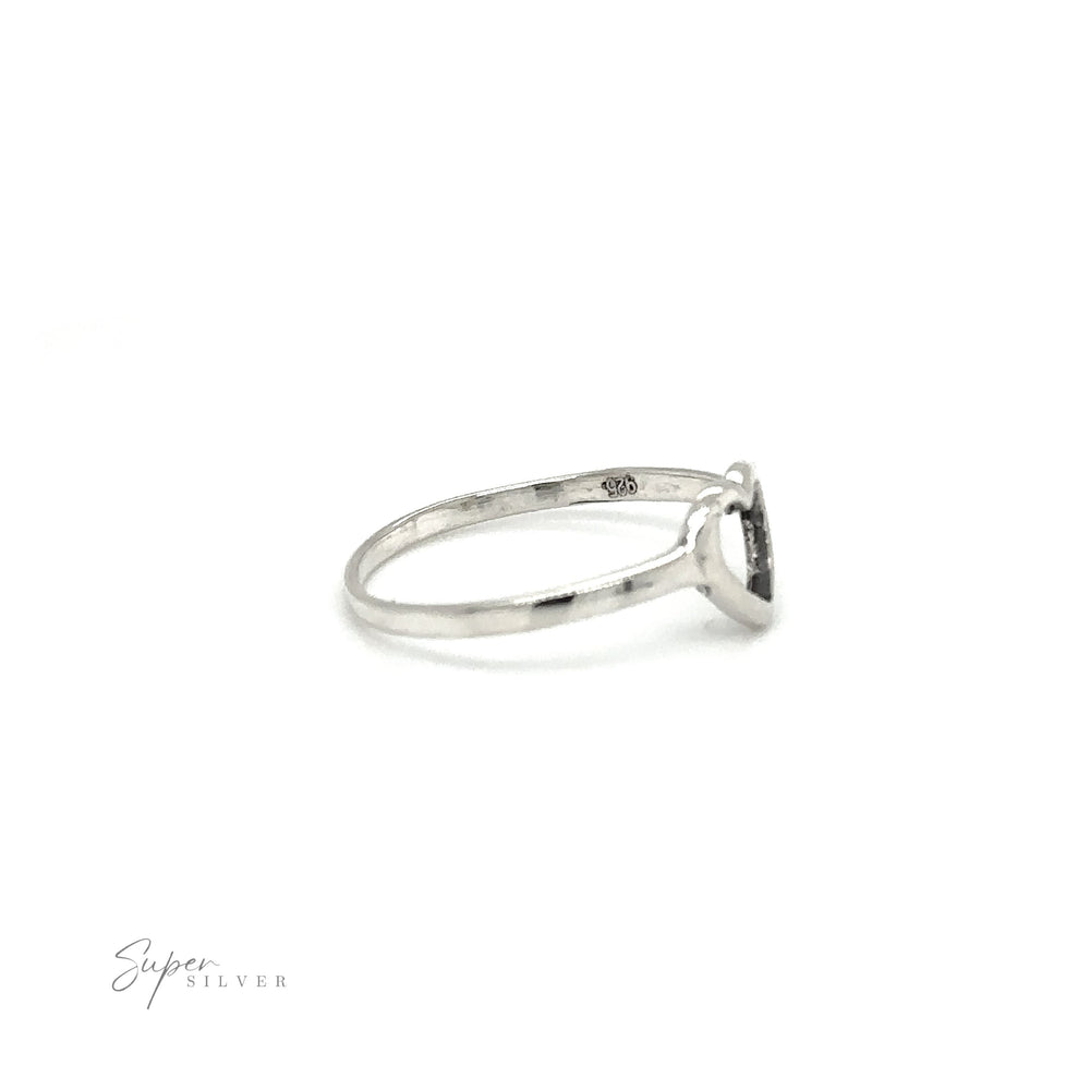 
                  
                    A delicate heart outline ring with a black stone in the middle, perfect for expressing love.
                  
                