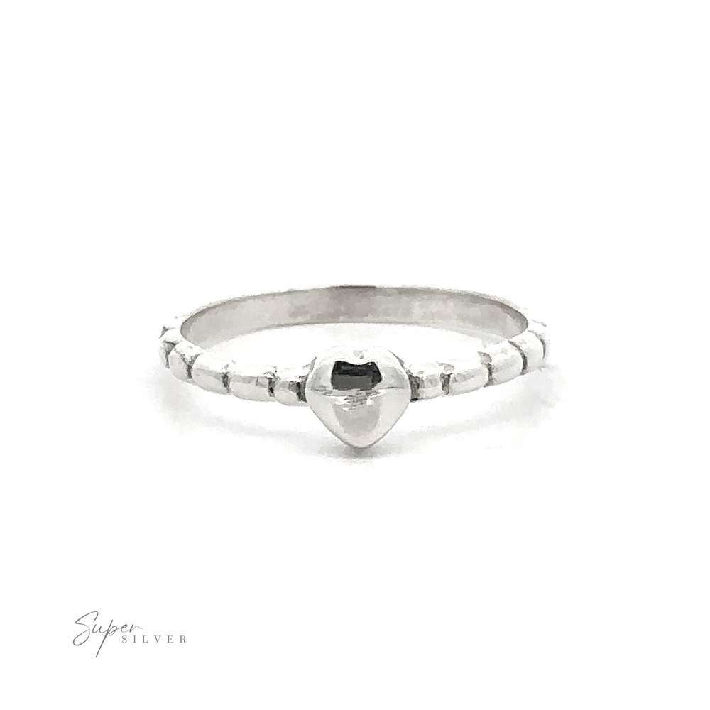 
                  
                    Petite Patterned Heart Band ring with a small heart-shaped black stone set in the center, displayed against a white background.
                  
                