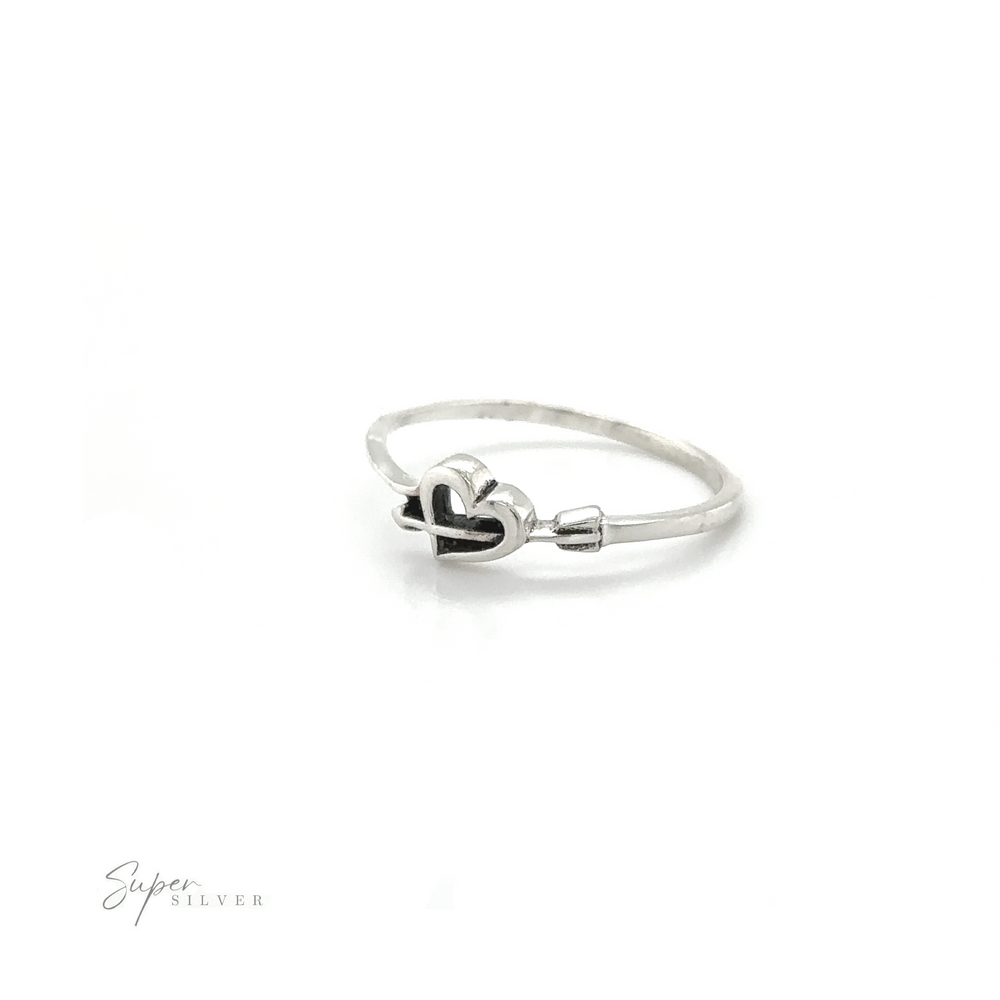 A Cupid's Arrow Heart Ring with a delicate heart engraved on it, symbolizing love and invoking the charm of Cupid's arrow.
