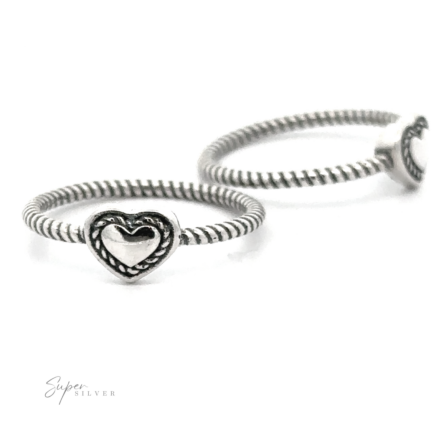 Two Oxidized Heart Rings with Twisted Band design, isolated on a white background.