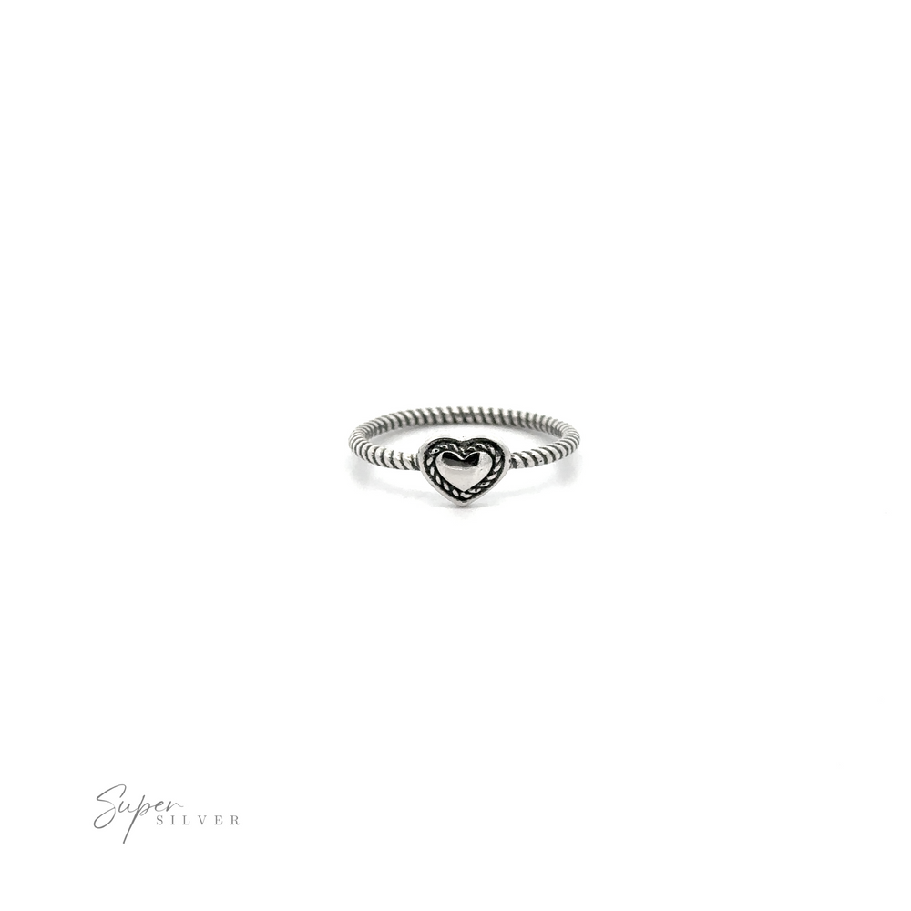 
                  
                    Oxidized heart ring with twisted band design, isolated on a white background with "super silver" signature at the bottom.
                  
                