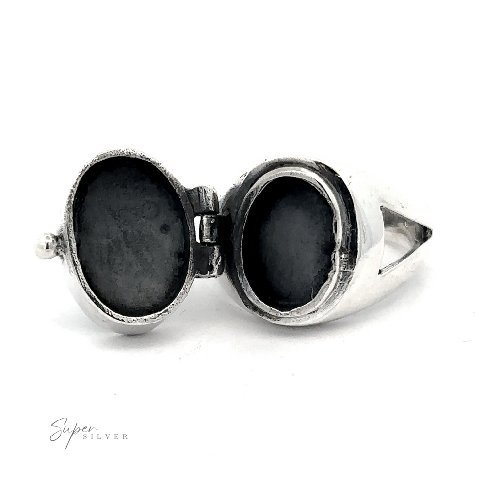 A .925 Sterling Silver locket ring with a hinged lid, shown open to reveal an empty inner compartment. The word "Scorpion Poison Ring" appears in the bottom left corner, reminiscent of a classic Scorpion Poison Ring.