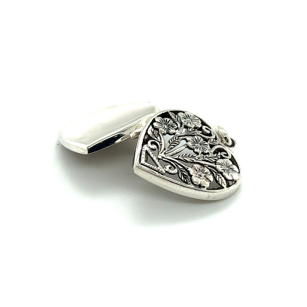 A Floral Heart Shaped Locket by Super Silver on a white surface.