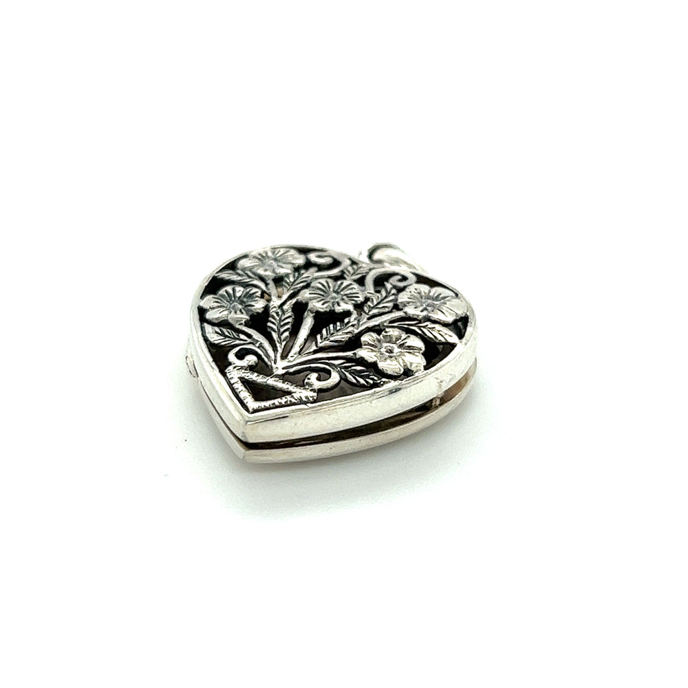 
                  
                    A Floral Heart Shaped Locket made of sterling silver, placed on a white background. (Super Silver)
                  
                