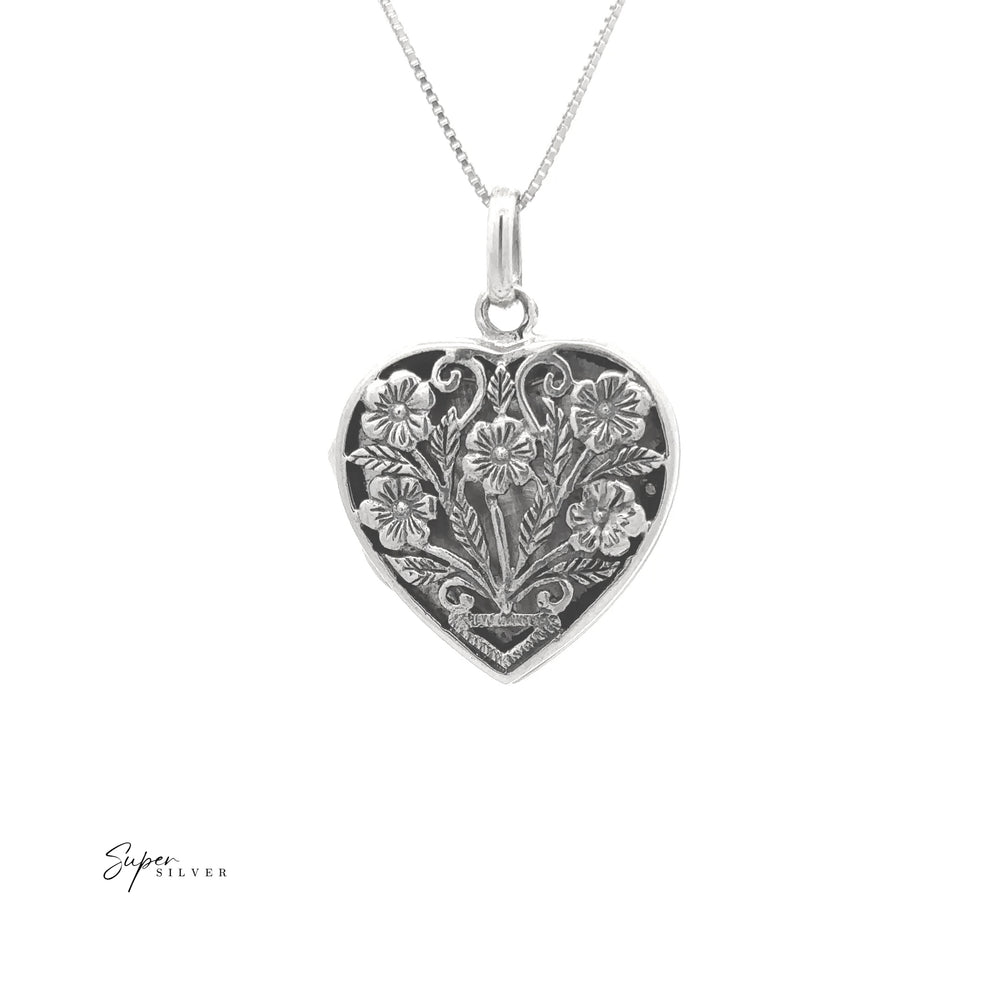 
                  
                    The Floral Heart Shaped Locket is a sterling silver heart pendant with intricate floral engravings on a delicate chain.
                  
                