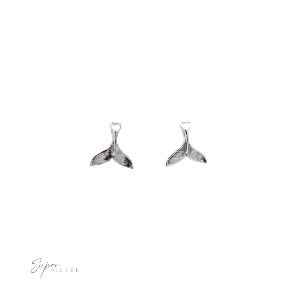 
                  
                    A pair of Whale Tail Studs, an ocean-inspired accessory, showcased on a white background.
                  
                