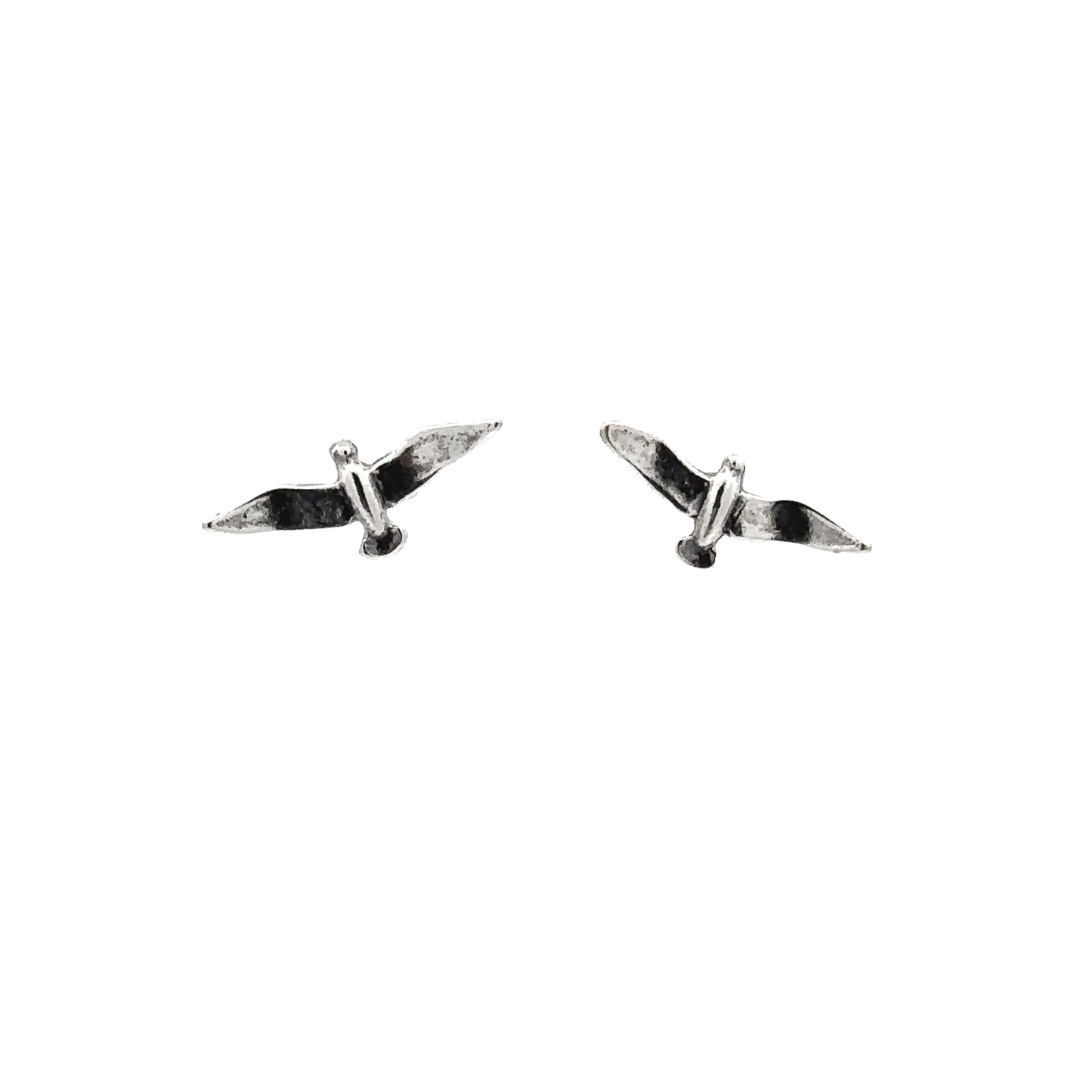 A pair of Seagull Studs on a white background.