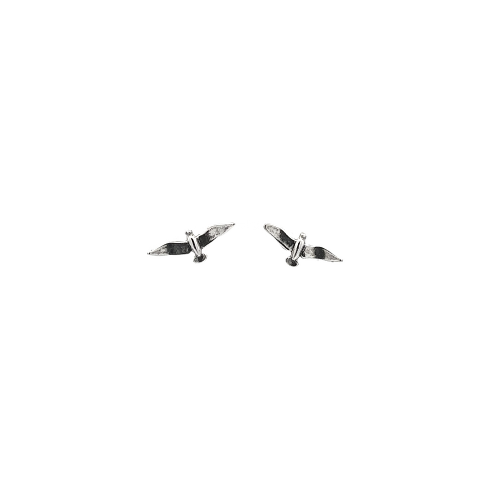 
                  
                    A pair of Seagull Studs on a white background.
                  
                