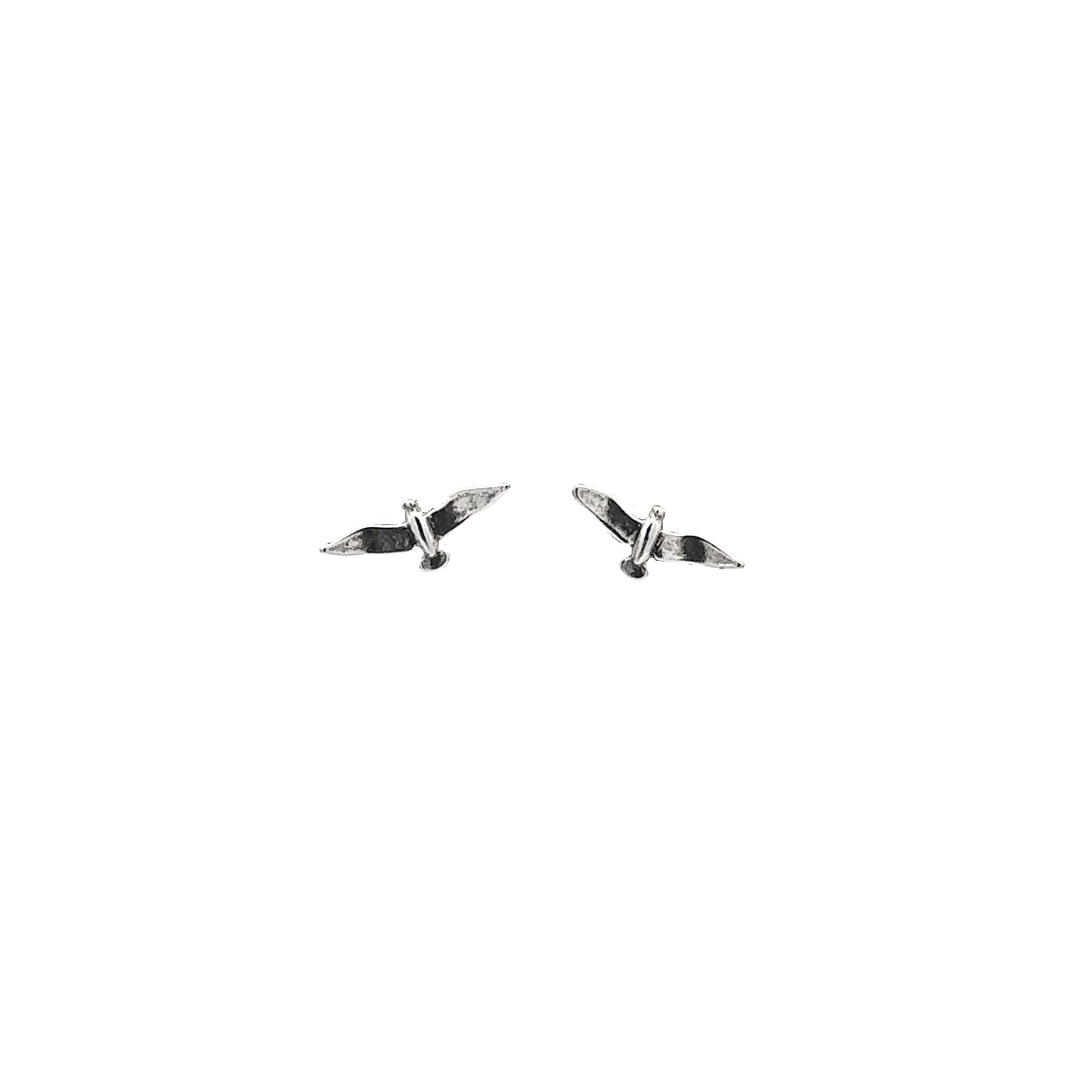 A pair of Seagull Studs on a white background.