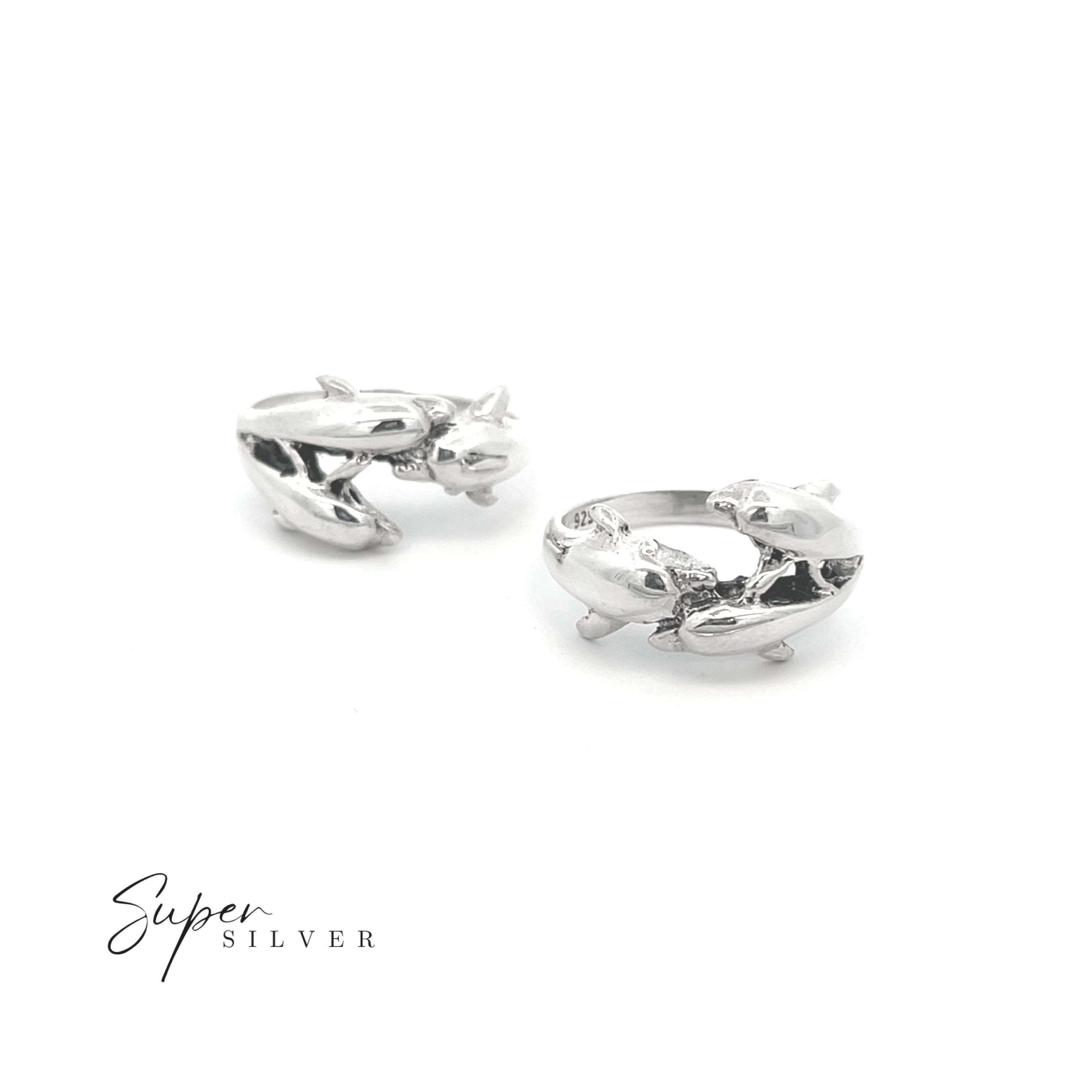 The Dolphin Pod Ring is a silver ring featuring a dolphin design, perfect for ocean lovers and jewelry enthusiasts, displayed on a white background with "Super Silver" in the corner.