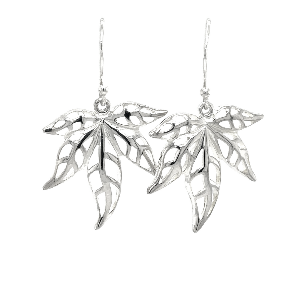 A pair of Super Silver's Silver Maple Leaves Dangle Earrings on a white background.