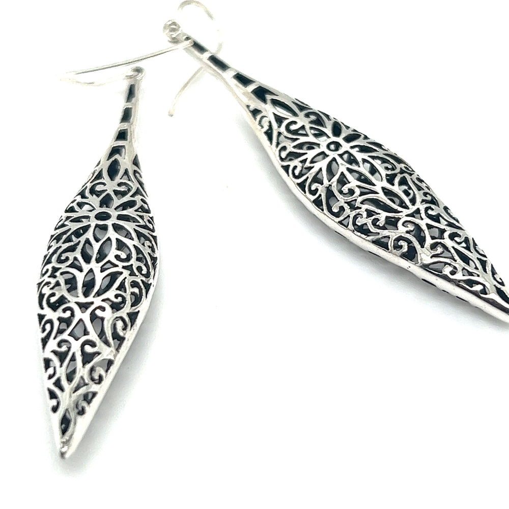 A pair of Super Silver Long Bali Inspired Filigree Puffed Earrings with intricate filigree designs.