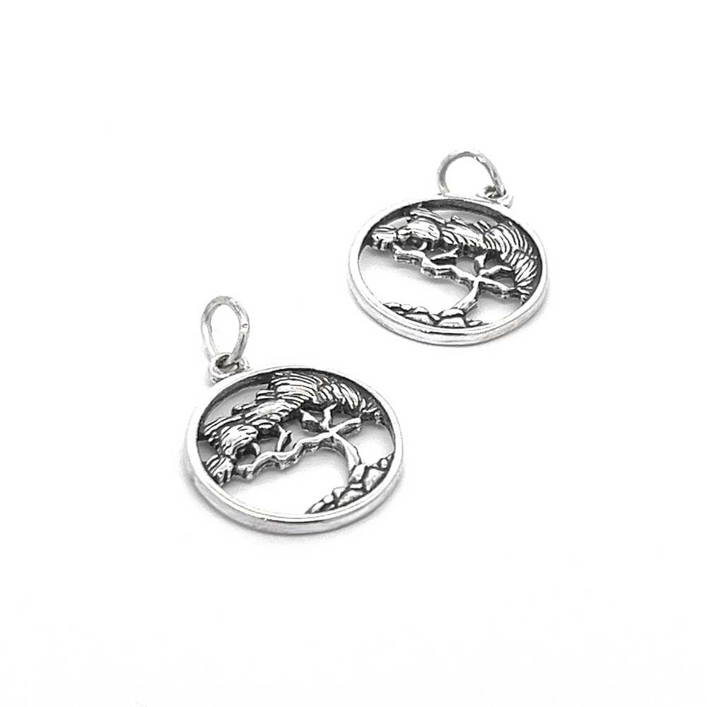 The Cypress Tree Charm features two circular sterling silver pendants with a captivating tree design, embodying the beauty and essence of nature jewelry. Whether worn individually or as a pair, these charms radiate a timeless elegance inspired by the majestic cypress tree.