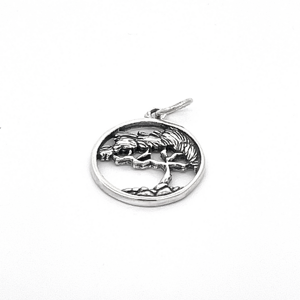 
                  
                    The Cypress Tree Charm, crafted from sterling silver, features an elegantly framed circular design with a cypress tree set against a pristine white background.
                  
                