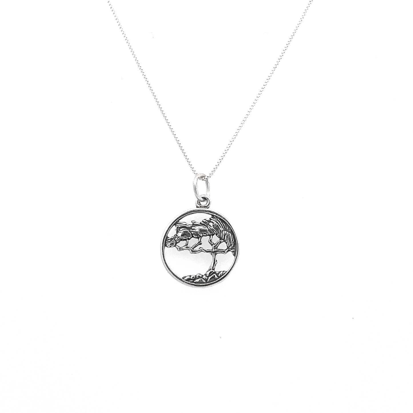 
                  
                    Cypress Tree Charm necklace crafted from sterling silver, showcasing a circular cypress tree design on a refined chain, ideal for nature jewelry lovers.
                  
                