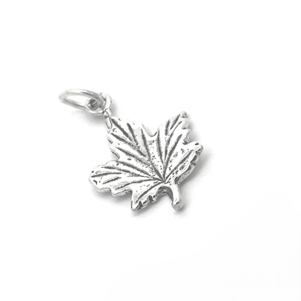 
                  
                    The Tiny Maple Leaf Charm is crafted from sterling silver and features intricate vein patterns along with a small loop for easy attachment, making it the perfect elegant addition to any autumn style.
                  
                