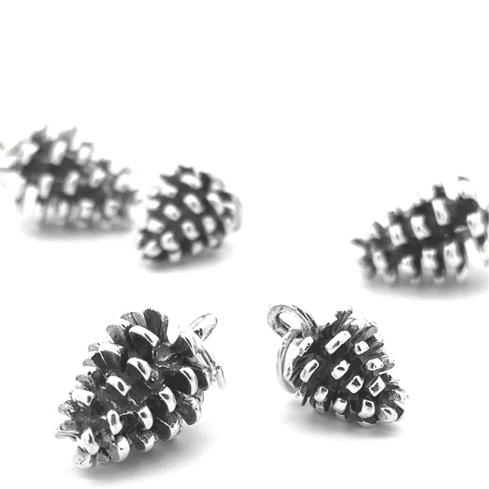 The Pinecone Pendant, designed for nature lovers, shines brilliantly on a white background.