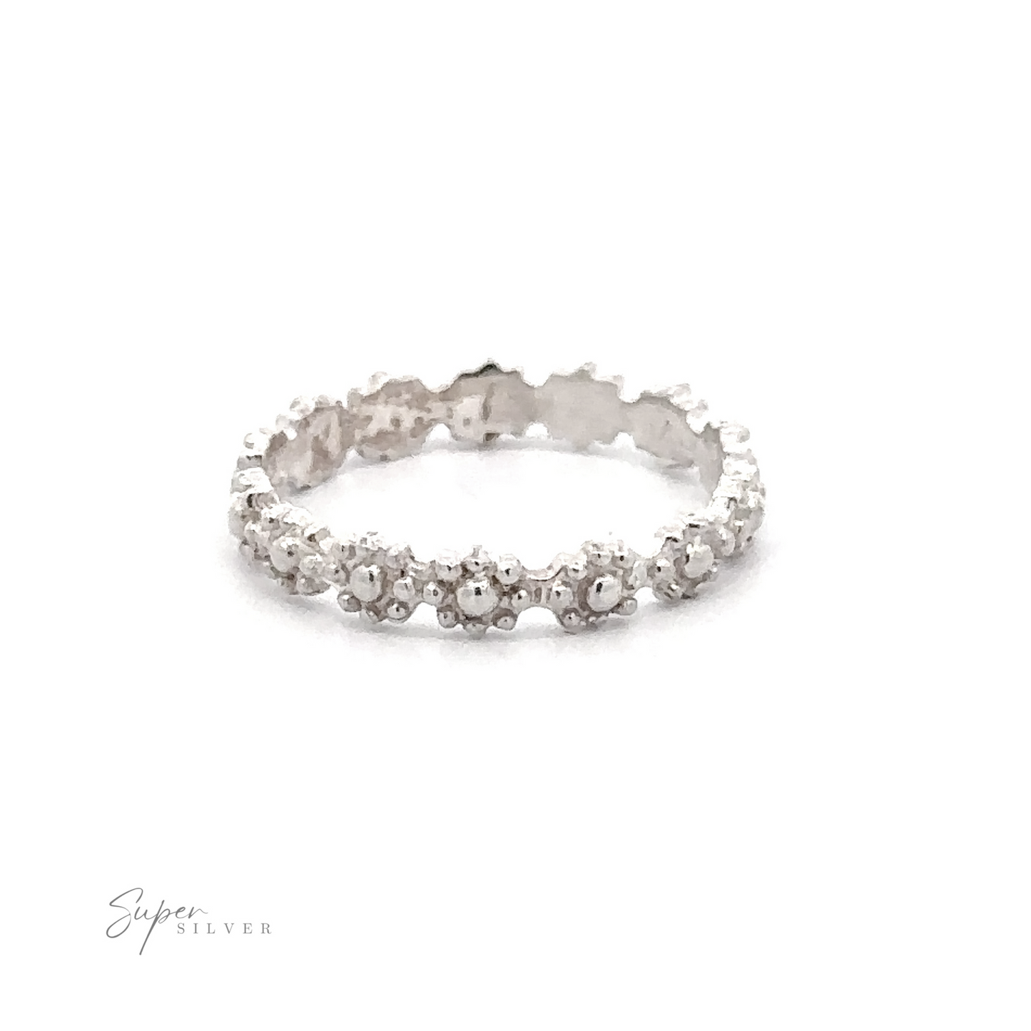 A Flowers Band Ring with a continuous row of small clear gemstones against a white background.