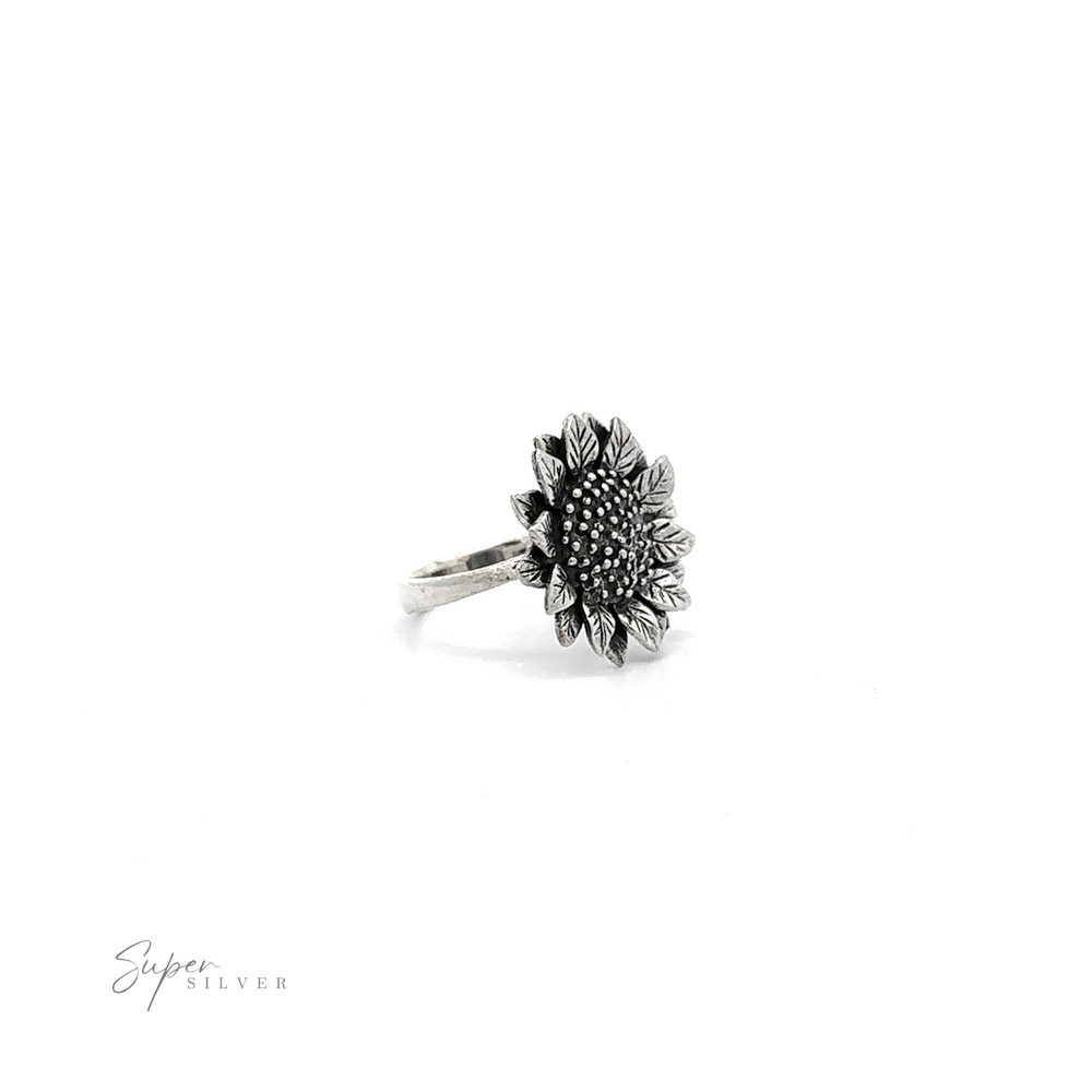 
                  
                    Large Sunflower Ring with detailed petal engravings and a textured center displayed on a white background.
                  
                