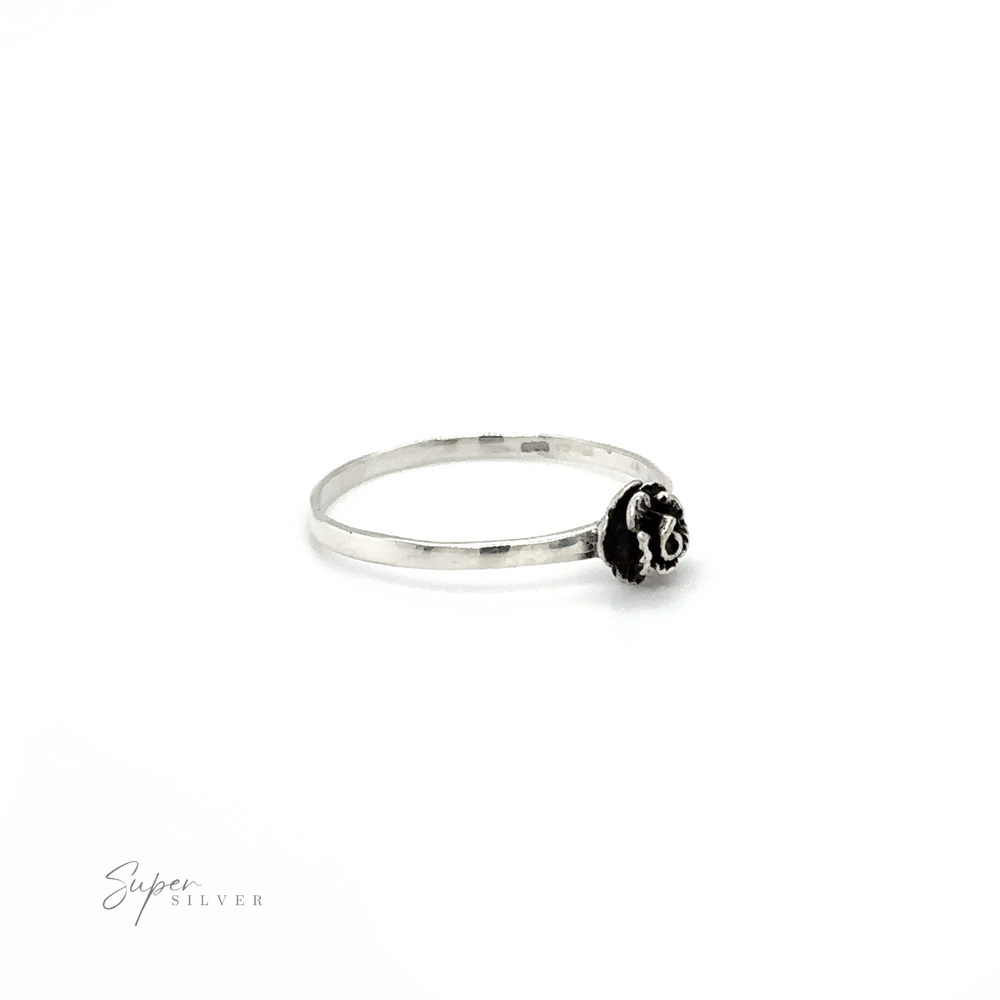 
                  
                    A Dainty Rose Ring with a black bead on it.
                  
                