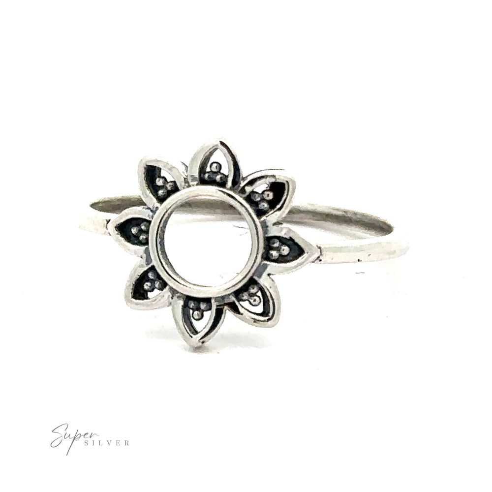 
                  
                    Open Flower Ring with a central stone on a white background.
                  
                