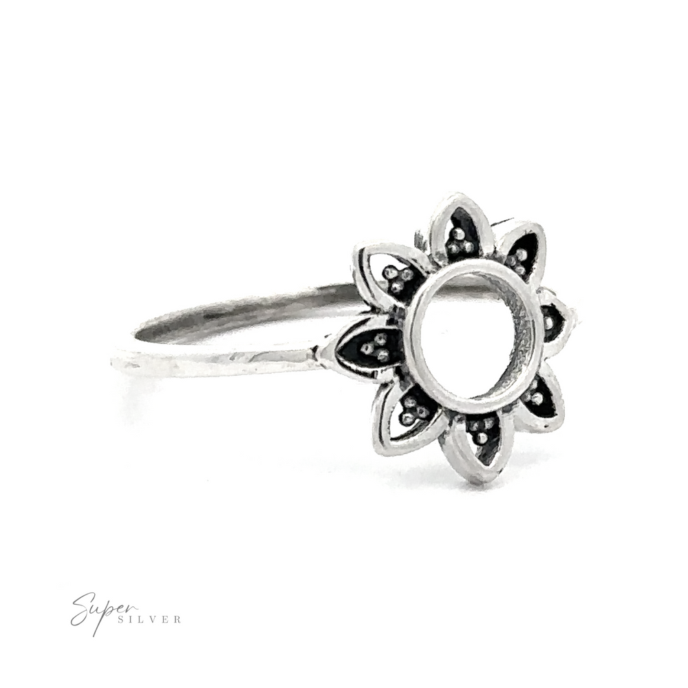 925 Sterling Silver Open Flower ring with a hollow center displayed against a white background.
