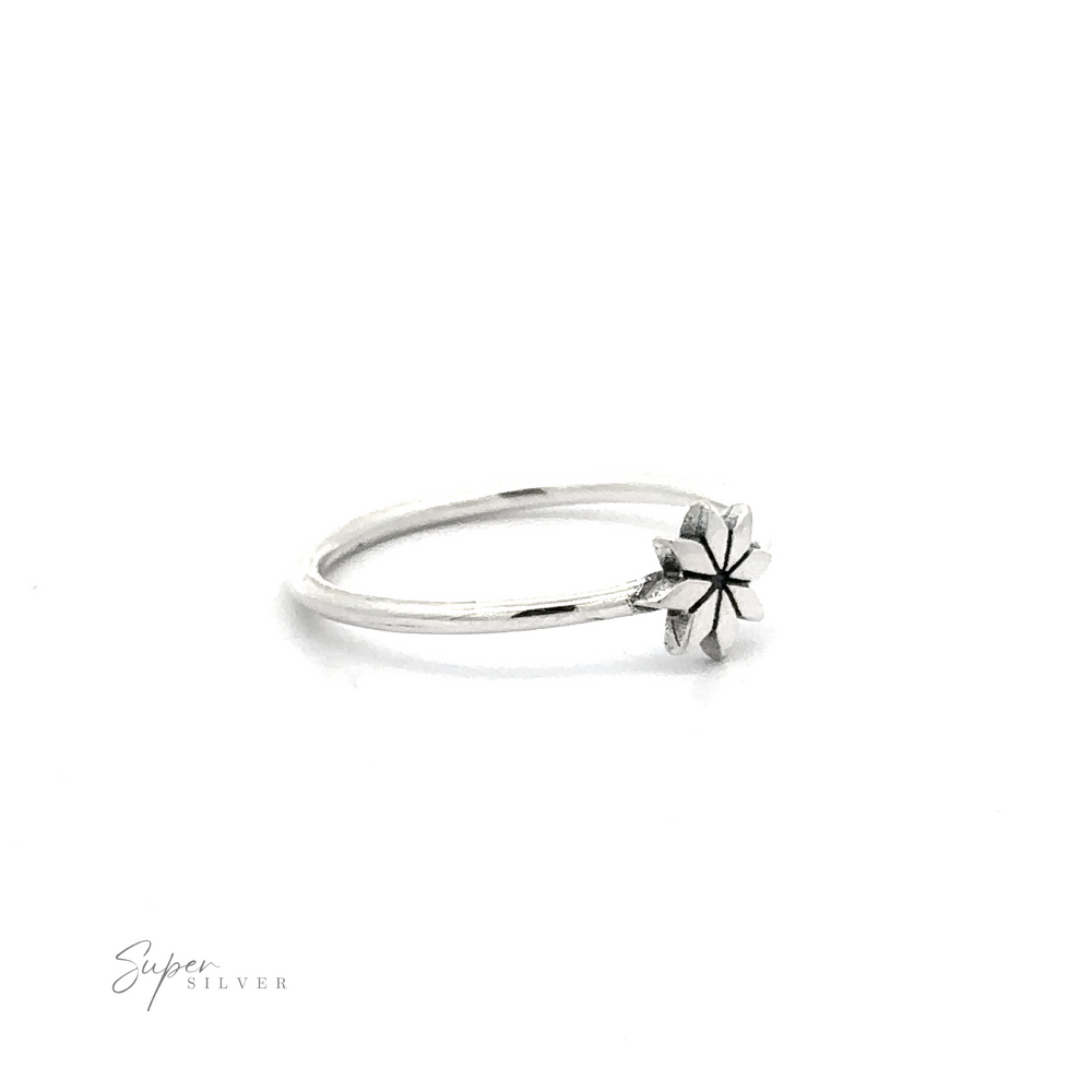 
                  
                    Geometric Flower Ring .925 sterling silver ring with a star-shaped setting on a white background.
                  
                