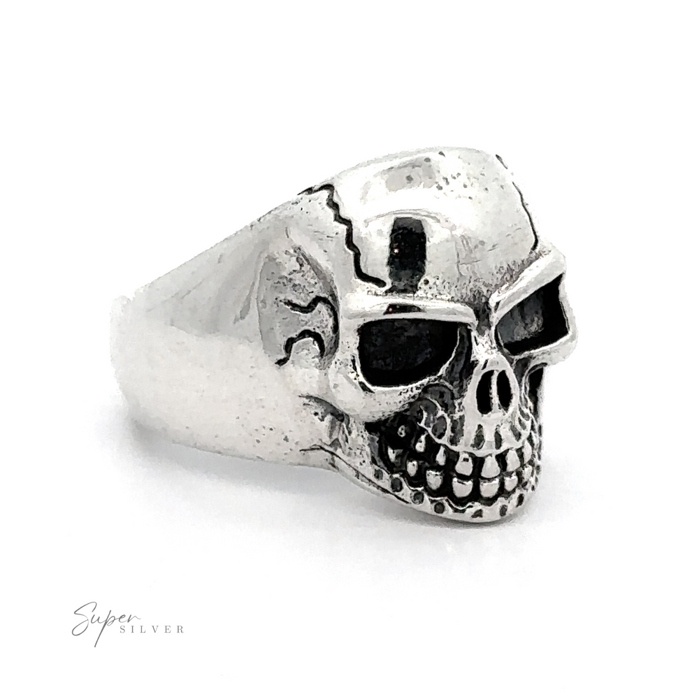 
                  
                    Detailed Veined Skull Statement Ring featuring a detailed skull design with darkened eye sockets and teeth, crafted from .925 Sterling Silver—a bold accessory for any look.
                  
                
