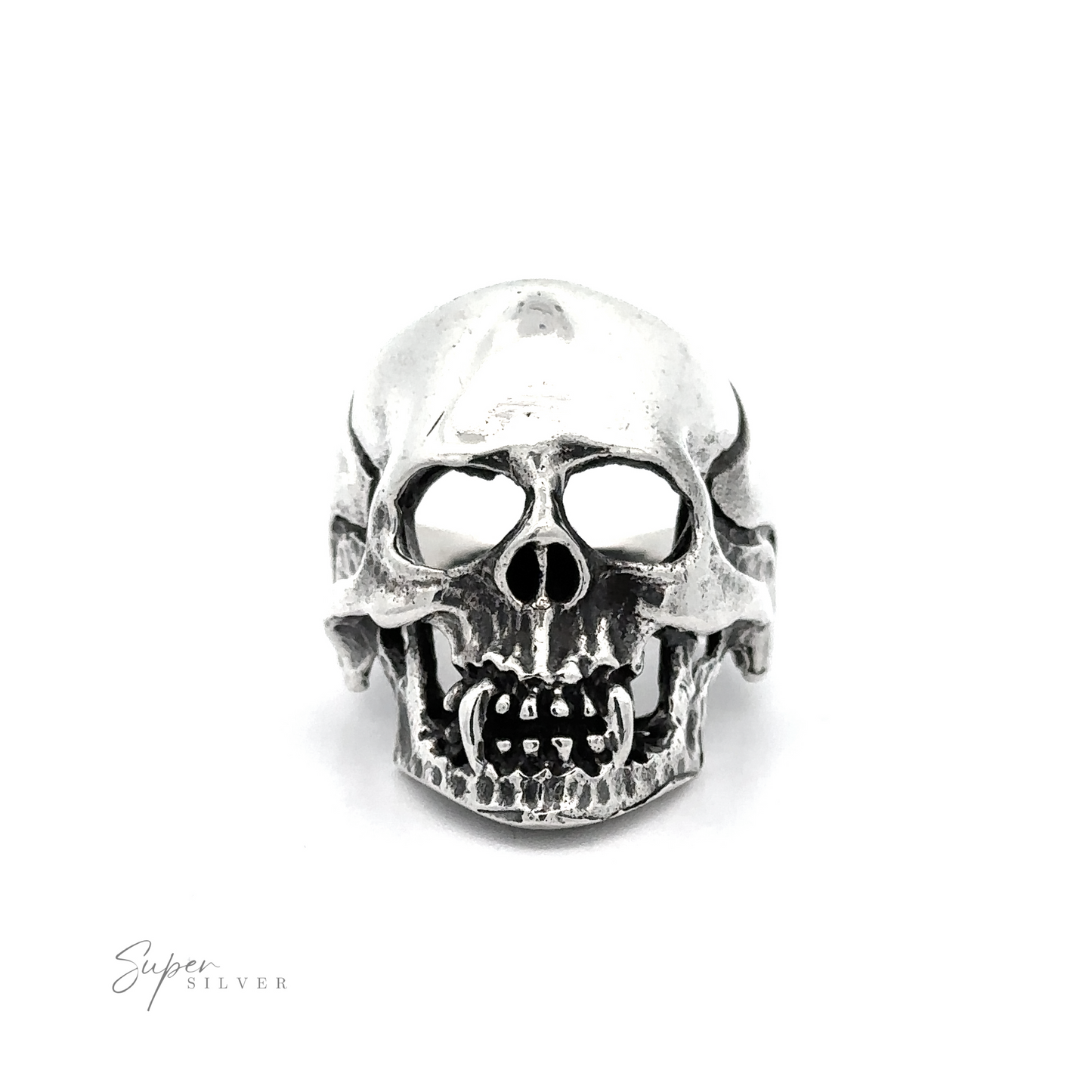 
                  
                    A silver Large Fanged Skull Statement Ring with prominent teeth and hollow eye sockets, embodying a gothic aesthetic. The background is plain white, and the words "Super Silver" are written in the bottom left corner.
                  
                