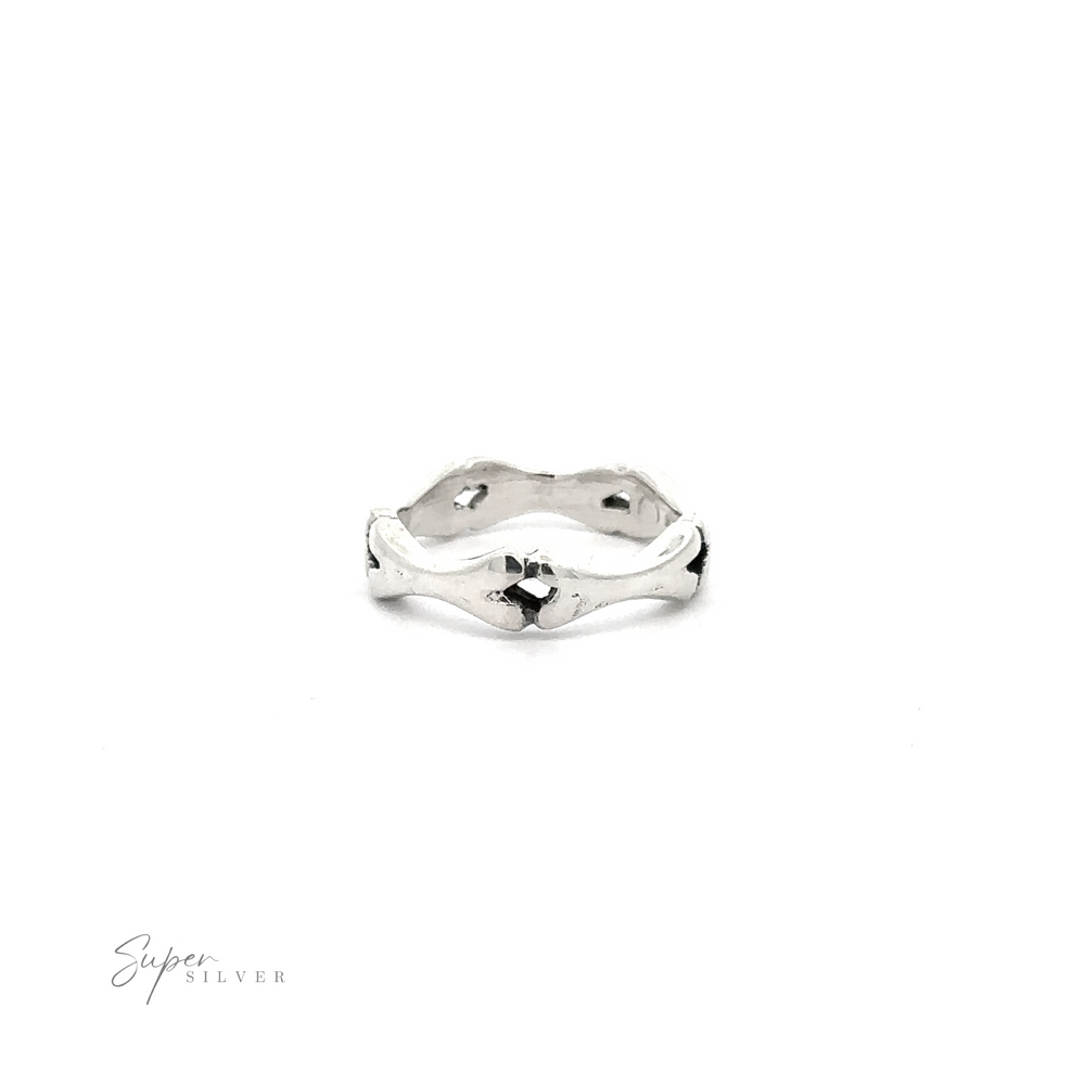 
                  
                    Silver Bones band ring with irregular, wavy edges displayed on a white background with the signature ".925 Sterling Silver" at the bottom.
                  
                